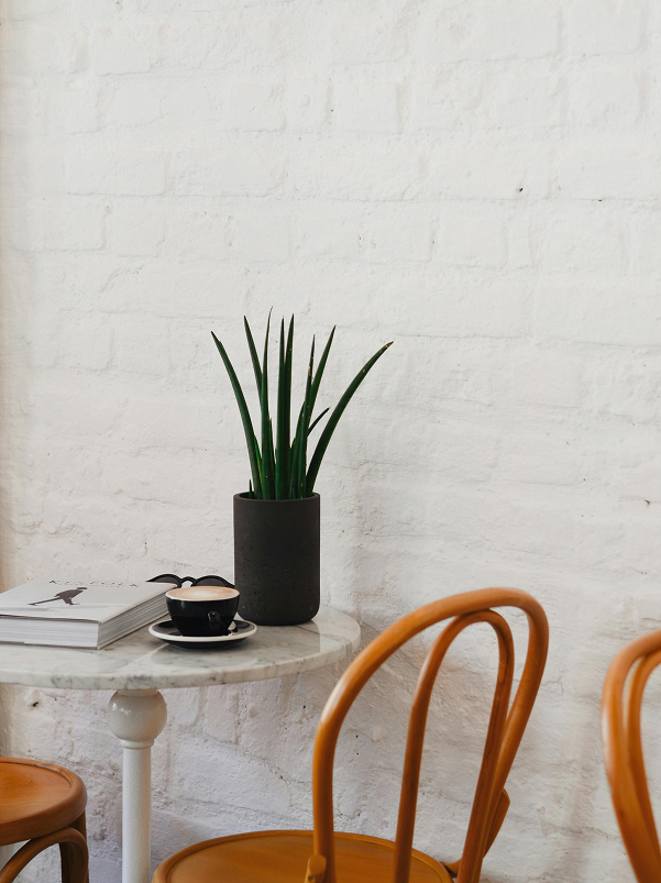 Photo of a chair next to a desk in a cafe